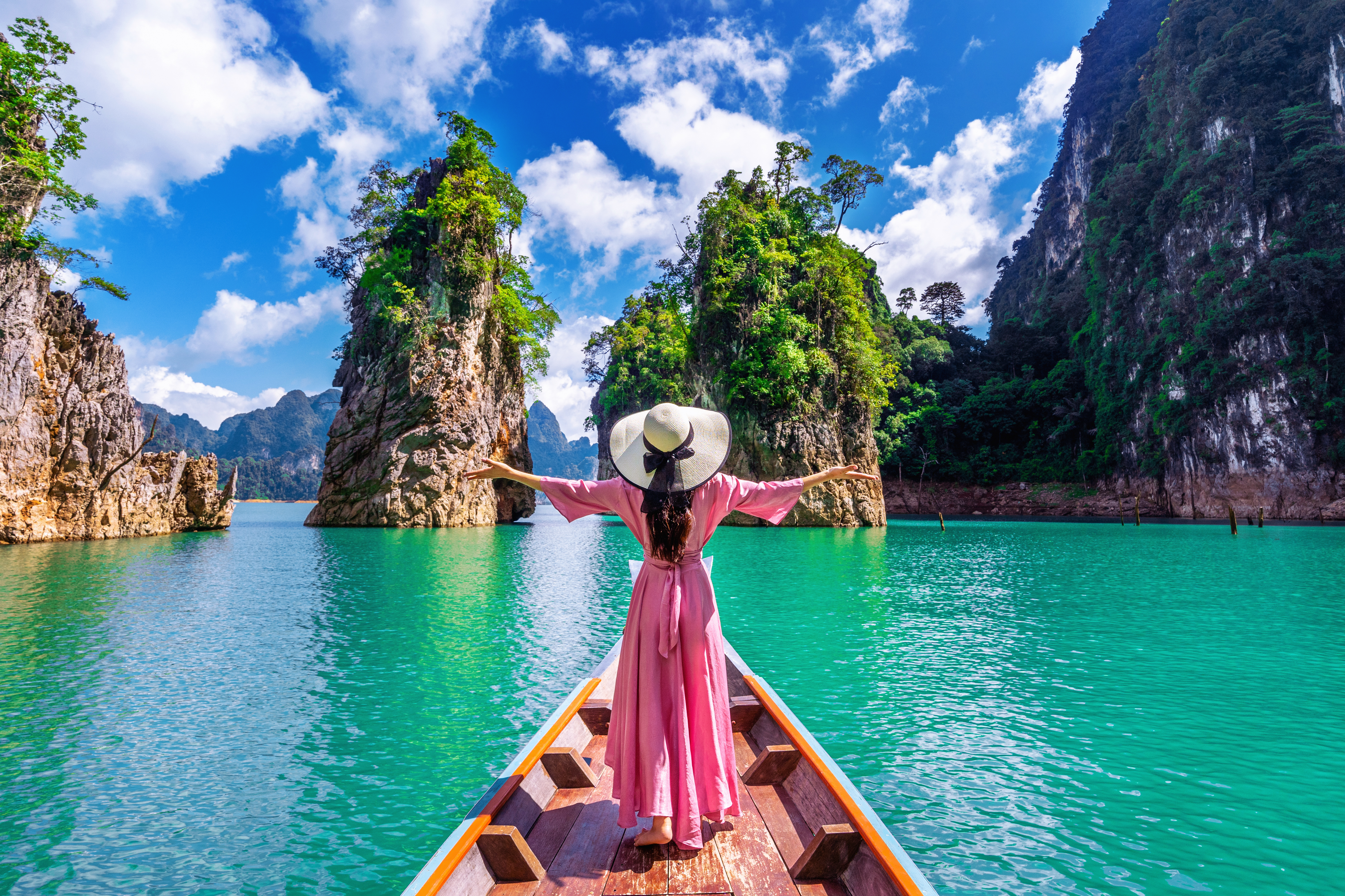beautiful girl standing boat looking mountains ratchaprapha dam khao sok national park surat thani province thailand