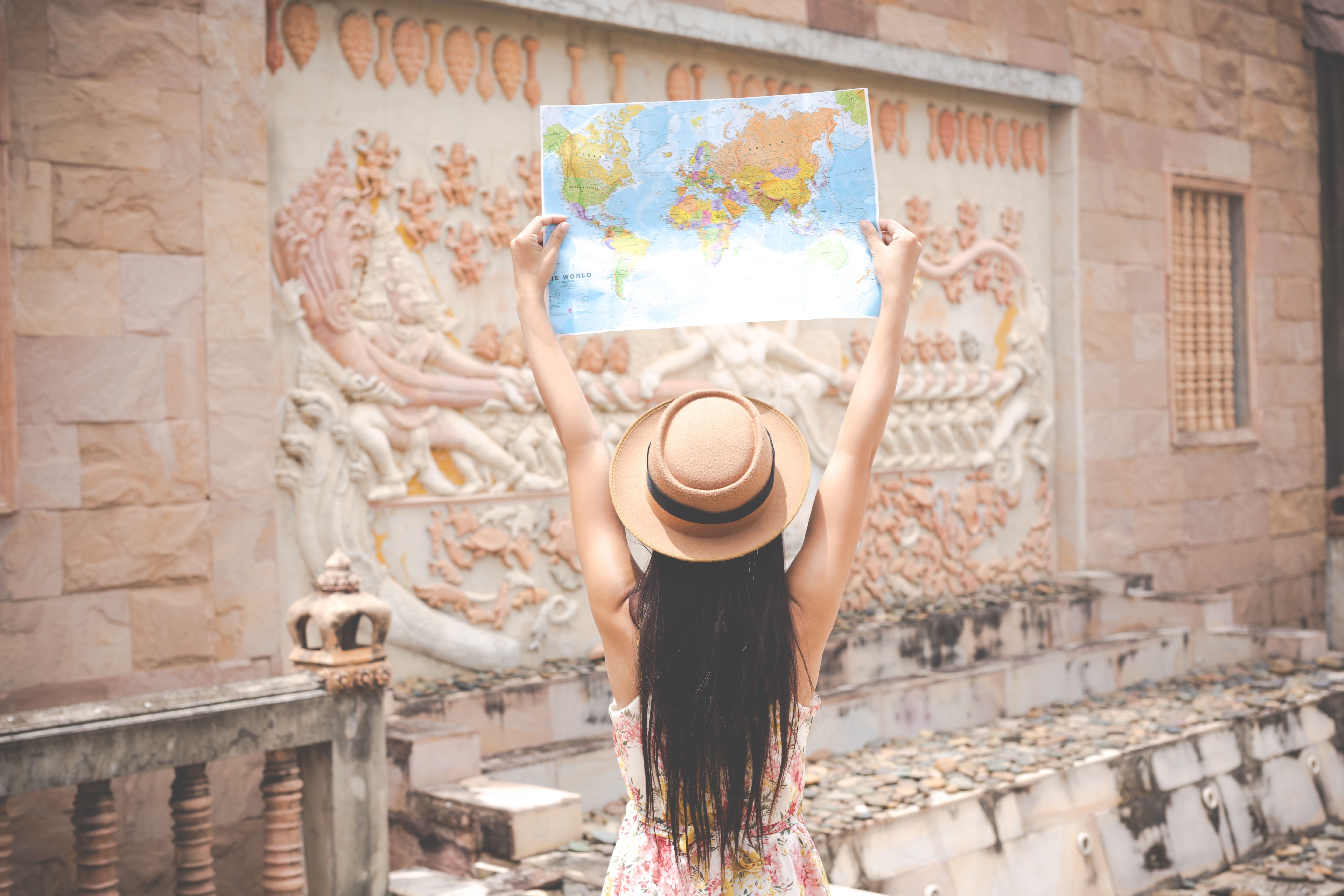 girl holds tourist map destination old town